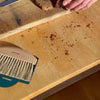 Video of hand sweeping bread crumbs off counter with  Andree Jardin table brush with metal dustpan 