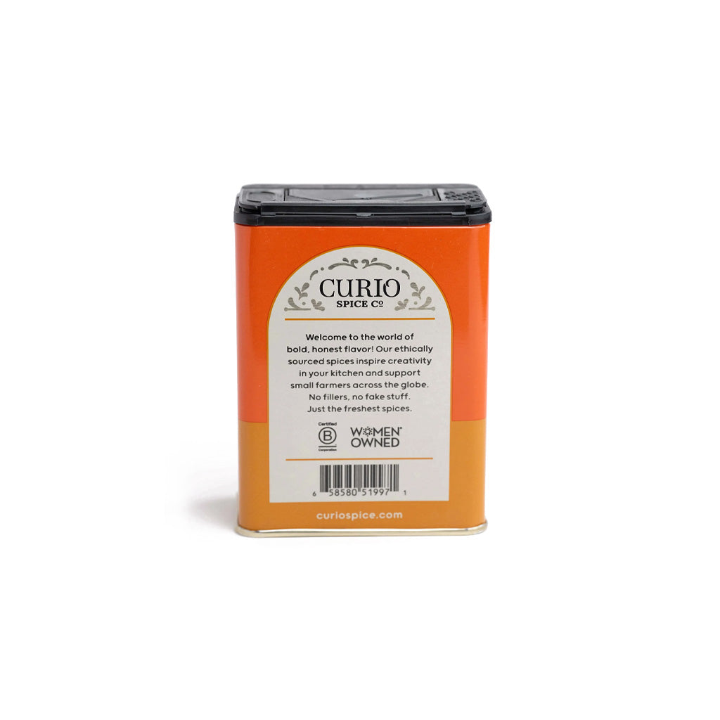 Orange tin of Curio Spice pumpkin spice everyday blend tin on white background