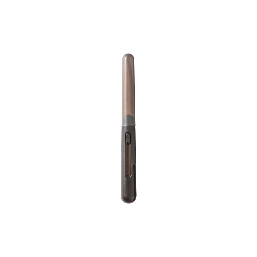 A slim pen-shaped pair of scissors with cap on white background