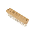 Wooden pet lint brush with rubber bristles on white background