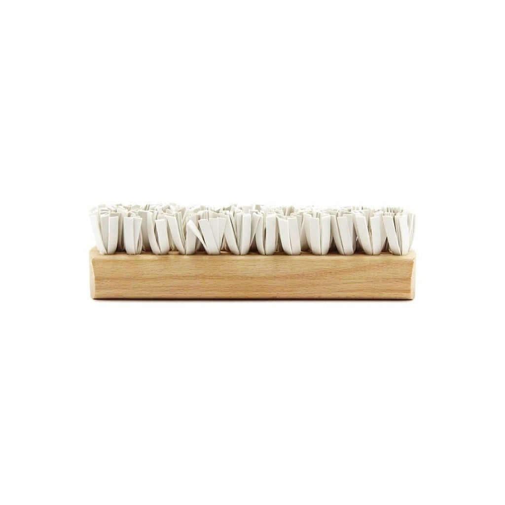 Wooden pet lint brush with rubber bristles on white background
