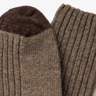 Close-up view of brown wool socks with dark brown toes.
