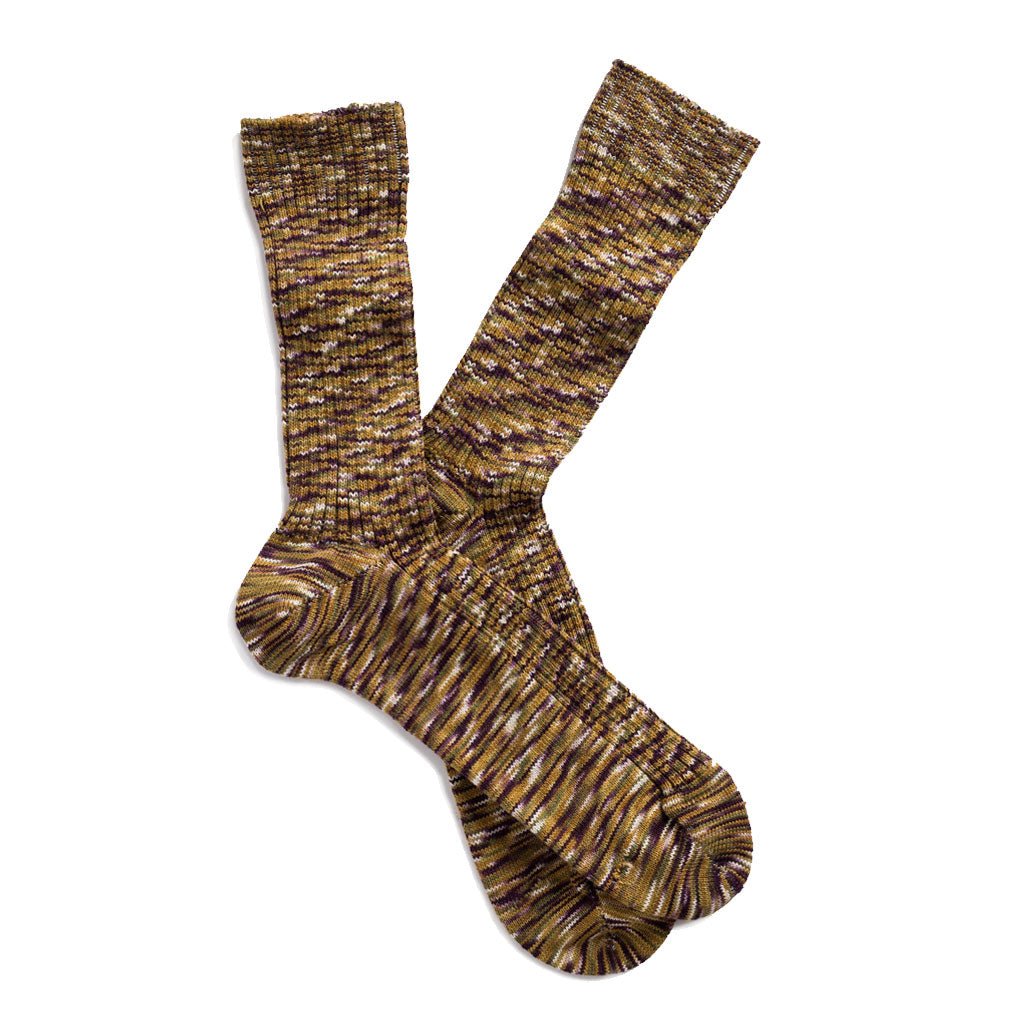 A pair of multicolored socks in a blend of moss green, golden brown, and cocoa.