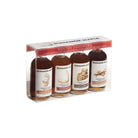 Set of four Runamok maple syrup bottles in clear packaging at an angle.