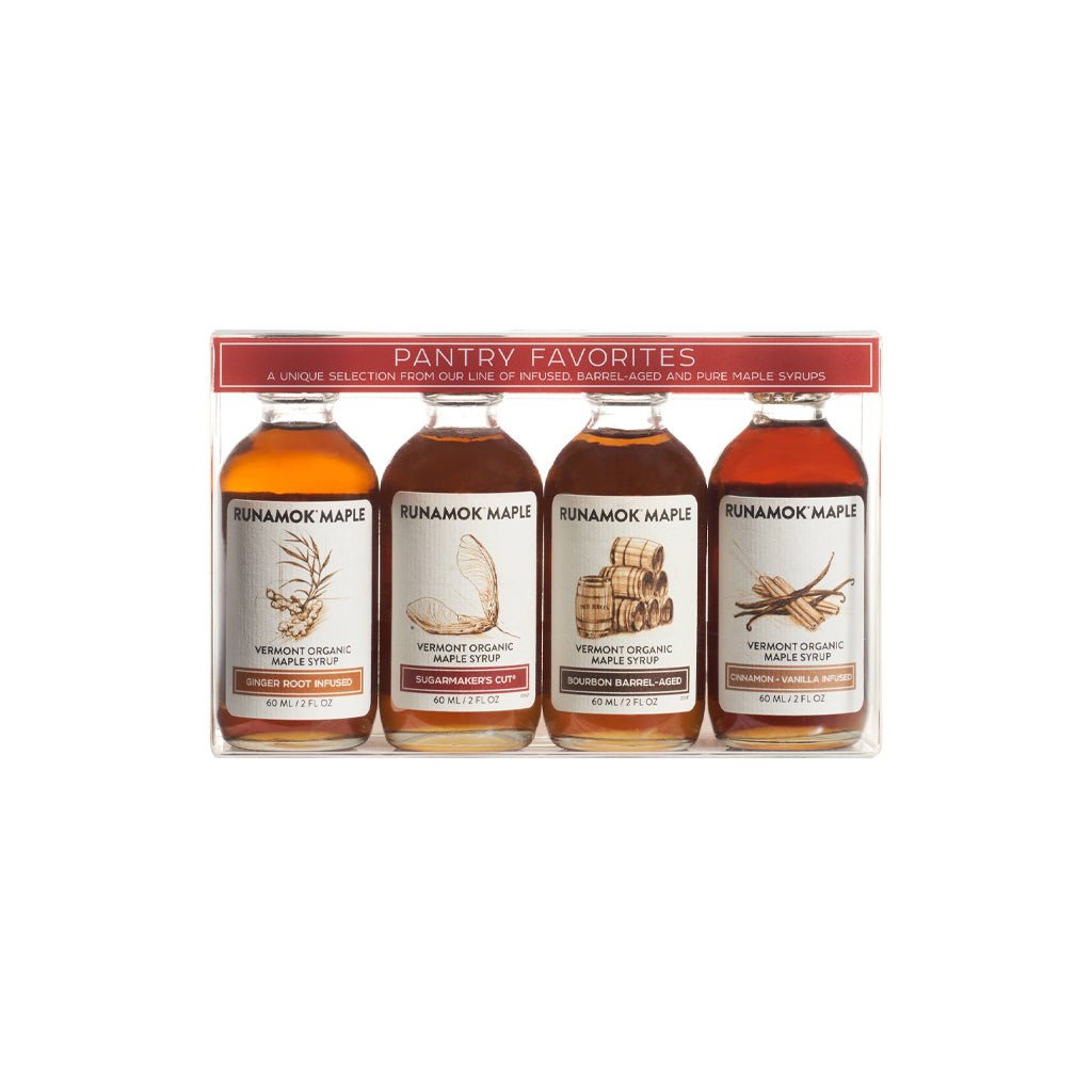 Set of four Runamok maple syrup bottles in clear packaging.