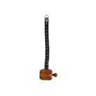 Wooden measuring tape with black ribbon unfurled.