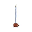 Wooden measuring tape with blue ribbon unfurled.