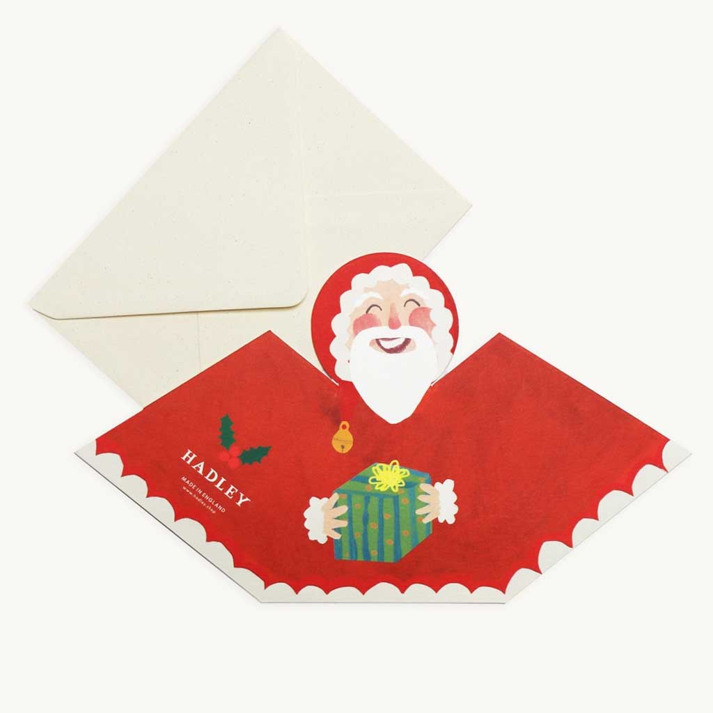 Christmas card with Santa Claus holding a gift, featuring the brand 'HADLEY'.