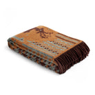 Folded blanket with an orange and brown pattern on a white background