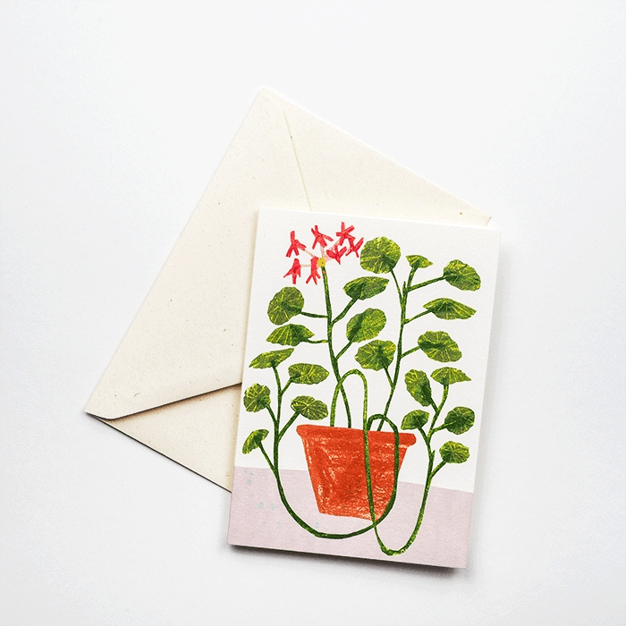 Greeting card with a potted plant illustration and envelope on a white background