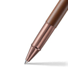 Brown Rose gold pen on a white background