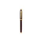 Pen with a gold clip on a white background