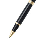 Black pen with gold accents on a white background