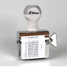 A rotating handheld stamp showing the following phrases: 
1.	AIR PARCEL POST
2.	DO NOT BEND
3.	FIRST CLASS MAIL
4.	FOR DEPOSIT ONLY
5.	HAND STAMP ONLY
6.	PARCEL POST
7.	PLEASE REMIT
8.	PRINTED MATTER
9.	REGISTERED
10.	SPECIAL DELIVERY
11.	SPECIAL HANDLING
12.	VIA AIR MAIL