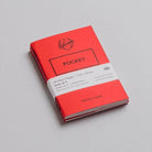Three pack of red pocket mini notebooks on light background