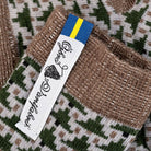Close-up of a woven fabric with a label featuring text and a logo.