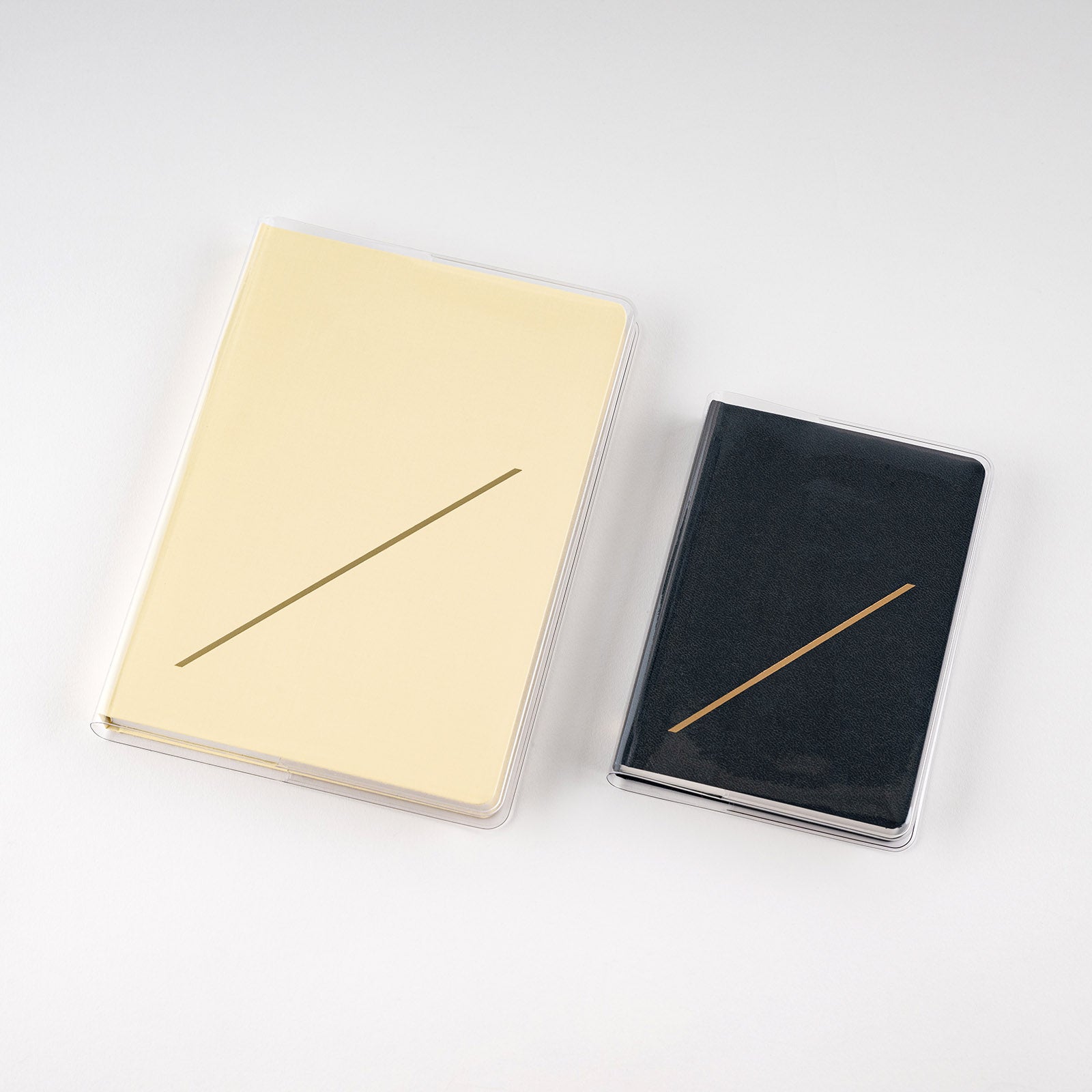 Clear PVC covers on Hobonichi HON books on white background