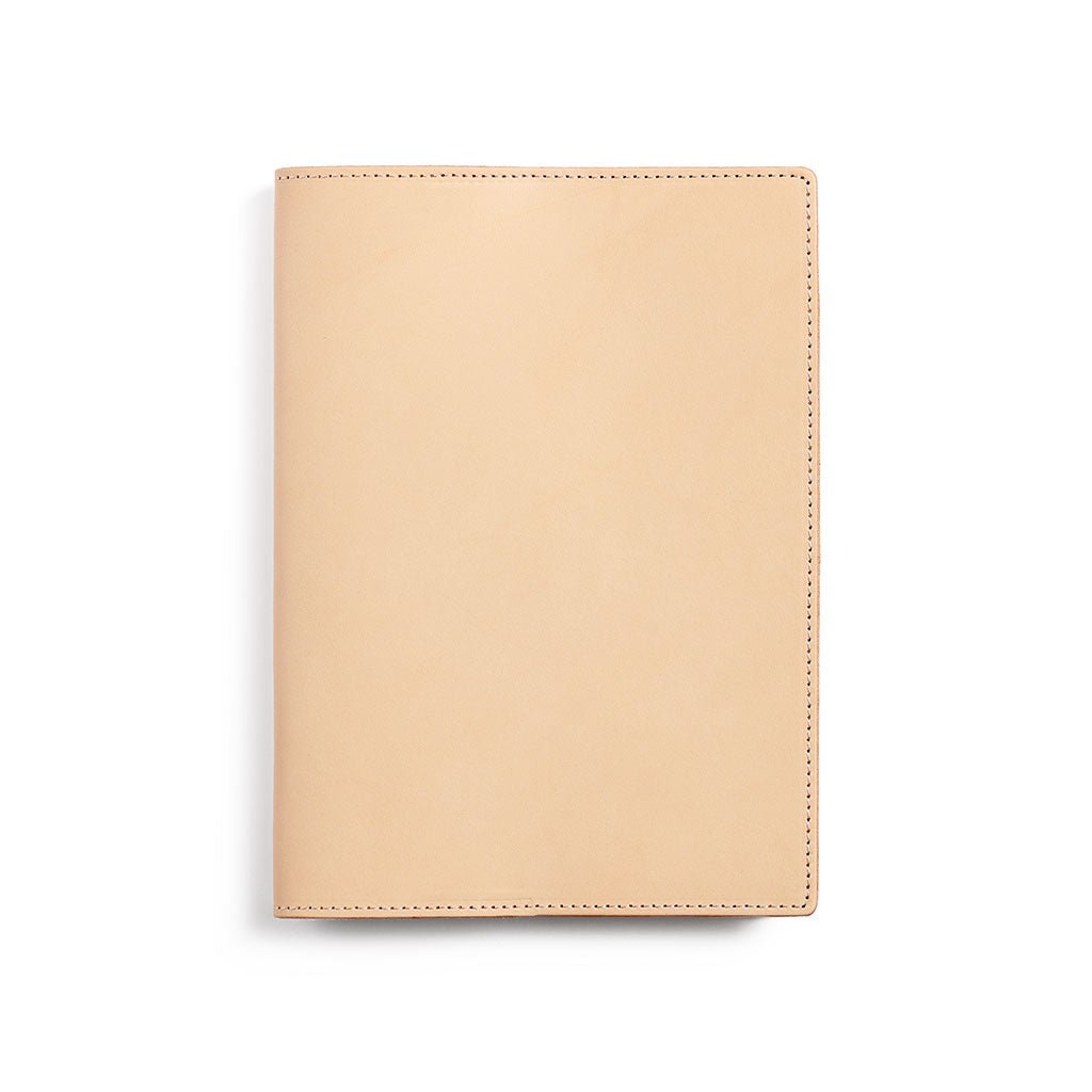 Natural undyed A5 leather notebook cover on white background