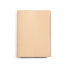 Natural undyed A5 leather notebook cover on white background