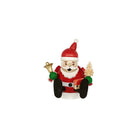 A small Santa Claus incense burner shown against a plain white background. The Santa figure is wearing a red hat and coat with white trim, black legs, and holds a gold bell in one hand and a small gold Christmas tree in the other.