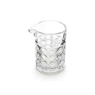 Clear mixing glass with diamond pattern on white background