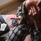 person applying sore muscle salve