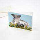 Illustrated sheep and baby lamb card standing up on light background