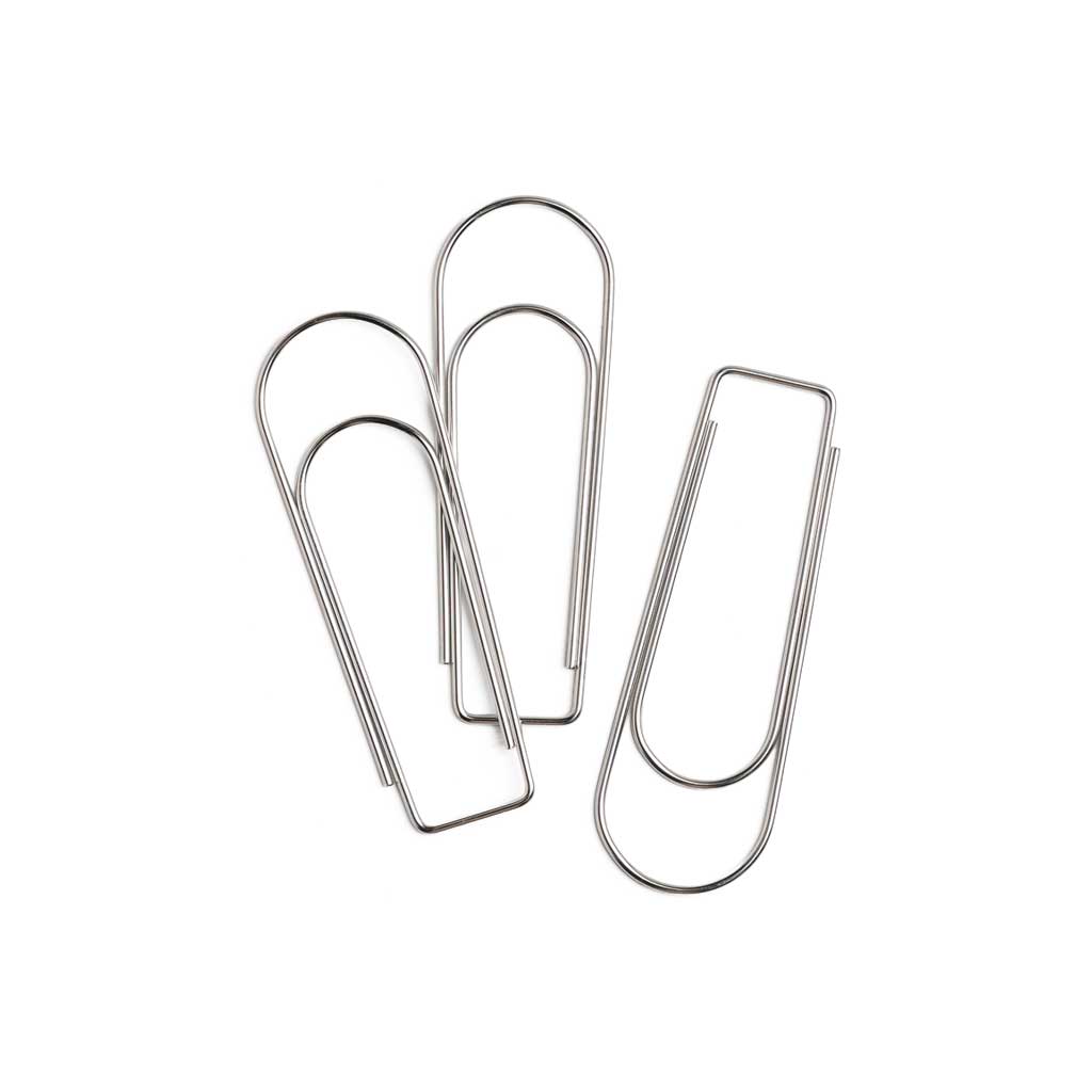 Three jumbo-sized metal paper clips on a white background