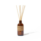 Brown diffuser bottle with wooden sticks on a white background
