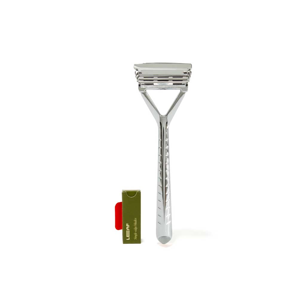 Stainless steel Leaf refillable razor with pack of blades on white background