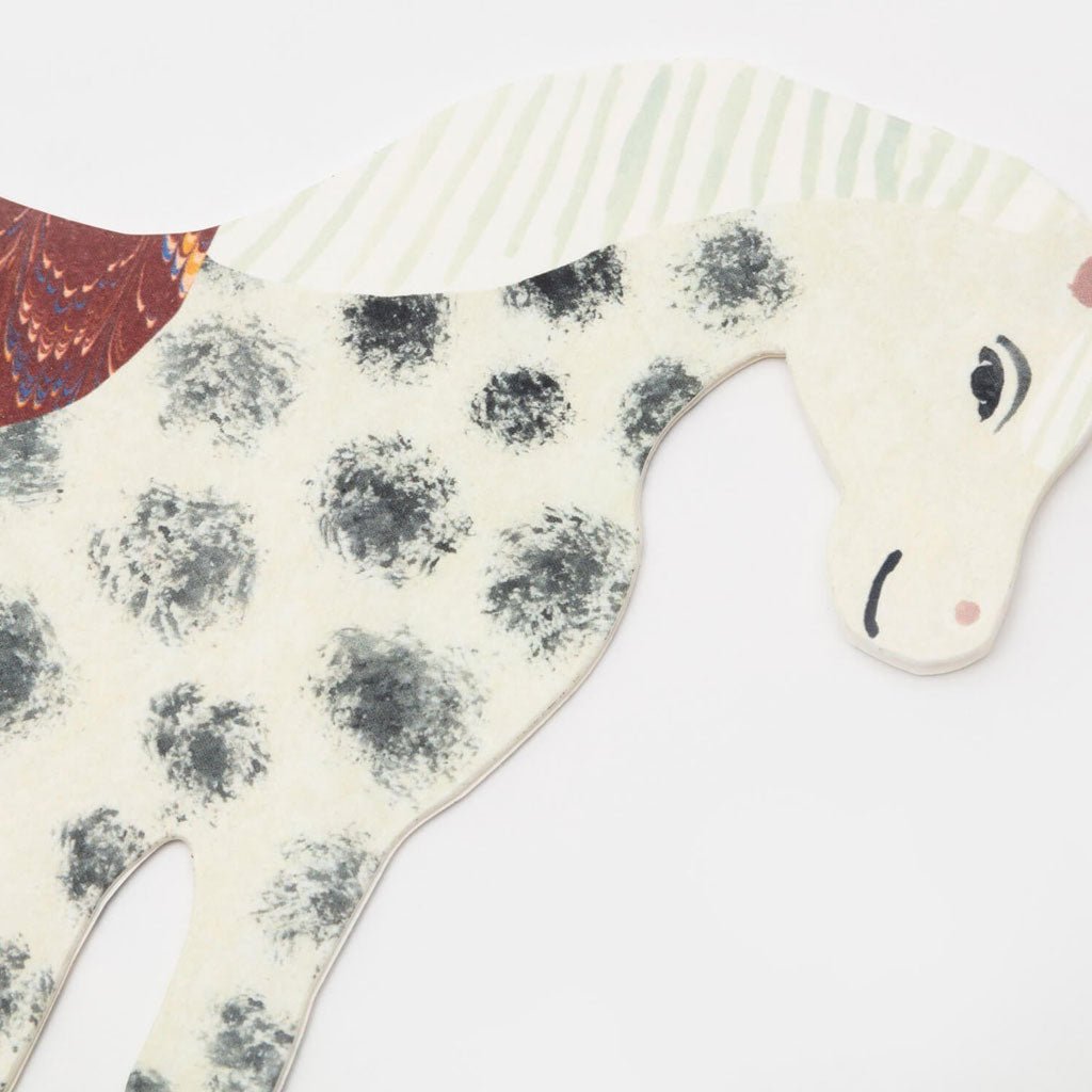 Close-up of horse's face on white background