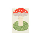 Red mushroom card on green grassy base with envelope on white background