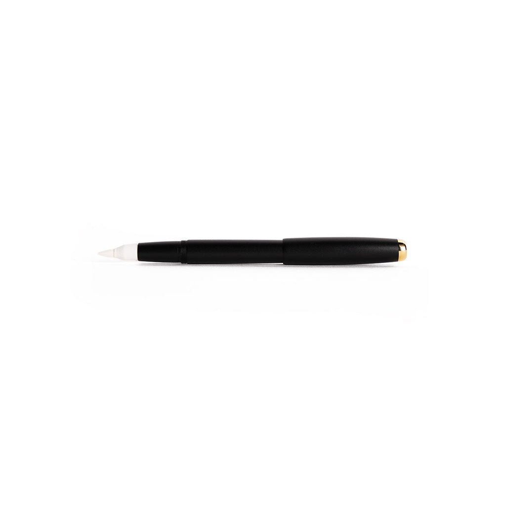 Black pen with a white tip on a white background