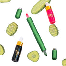 A green dual-sided pen with a pickle design next to bottles of ink and two green caps on white background with floating pickle designs