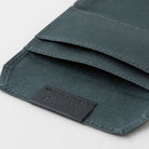 Open black zippered case against light background