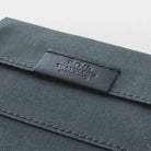 Black zippered case against light background