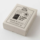 Box of Traveler's Company card size set with black leather cover on a white background