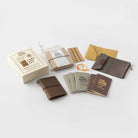 Contents of brown Card-size anniversary set against light background