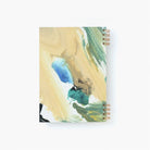 Notebook with artistic cover design on a white background