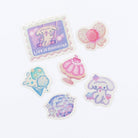 Set of six pastel pink and purple decorative stickers with playful illustrations on a white background