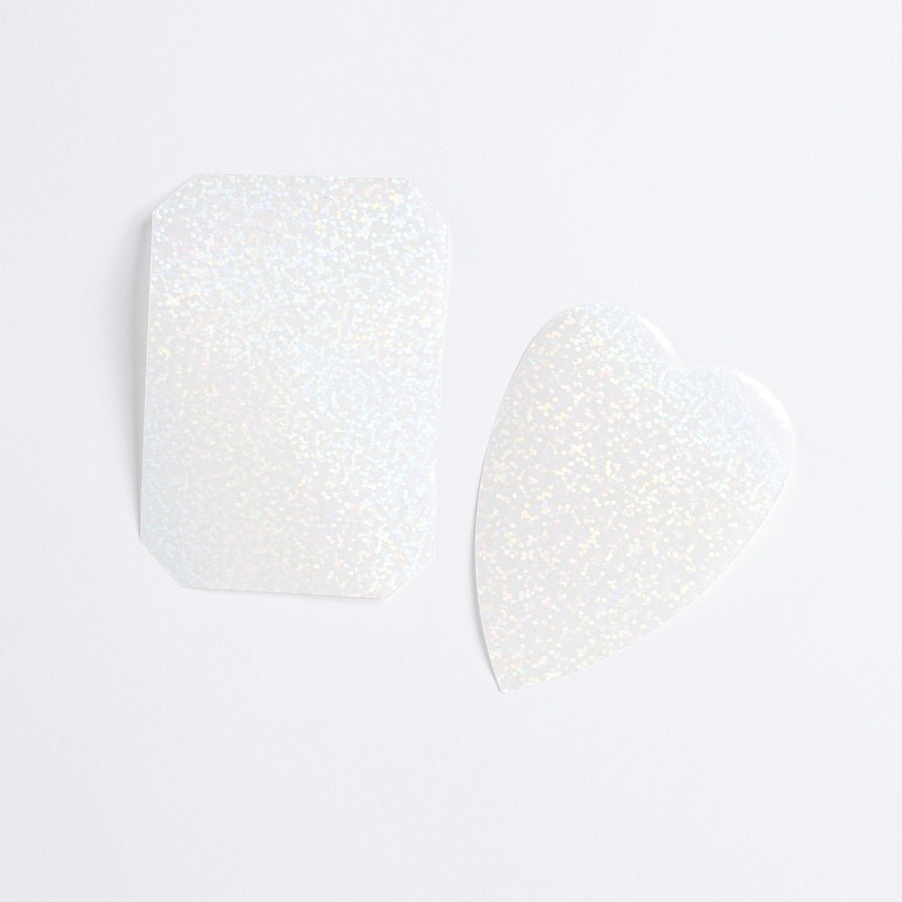 Two shimmery transparent layering stickers for planner on white background