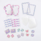 Set of pastel pink and purple decorative stickers with playful illustrations on a white background