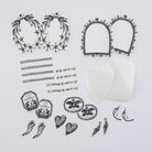 Collection of hand-drawn black and white Hobonichi not a dream stickers laying on white surface