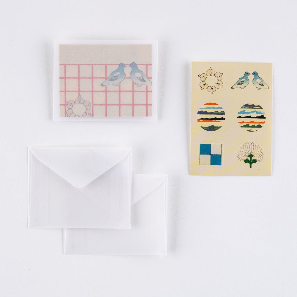 Two Unsodo mini envelopes and set of six envelope seals on a white background