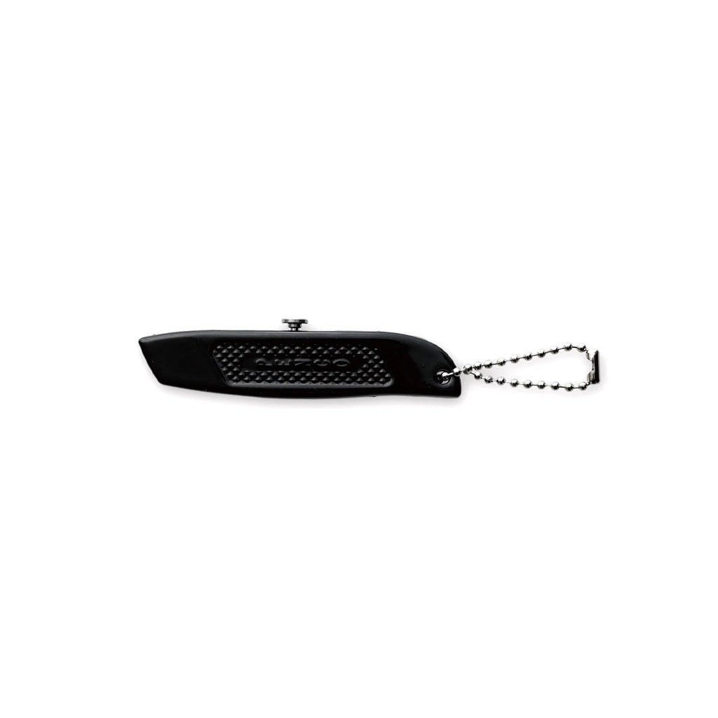 Black steel mini utility knife with silver hardware on white background