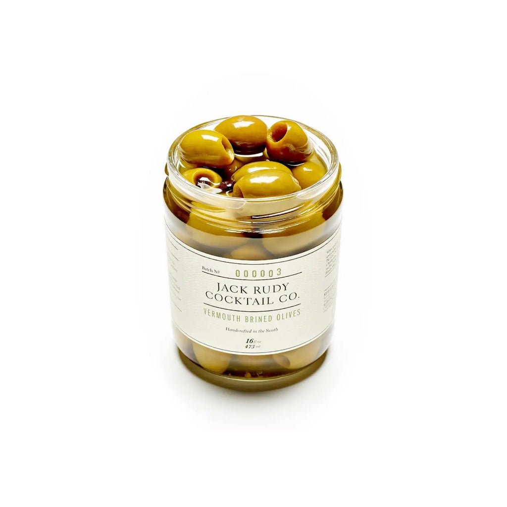 Jar of green vermouth brined olives with a label on a white background