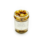 Jar of green vermouth brined olives with a label on a white background