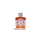 bottle of barrel aged orange bitters on white background
