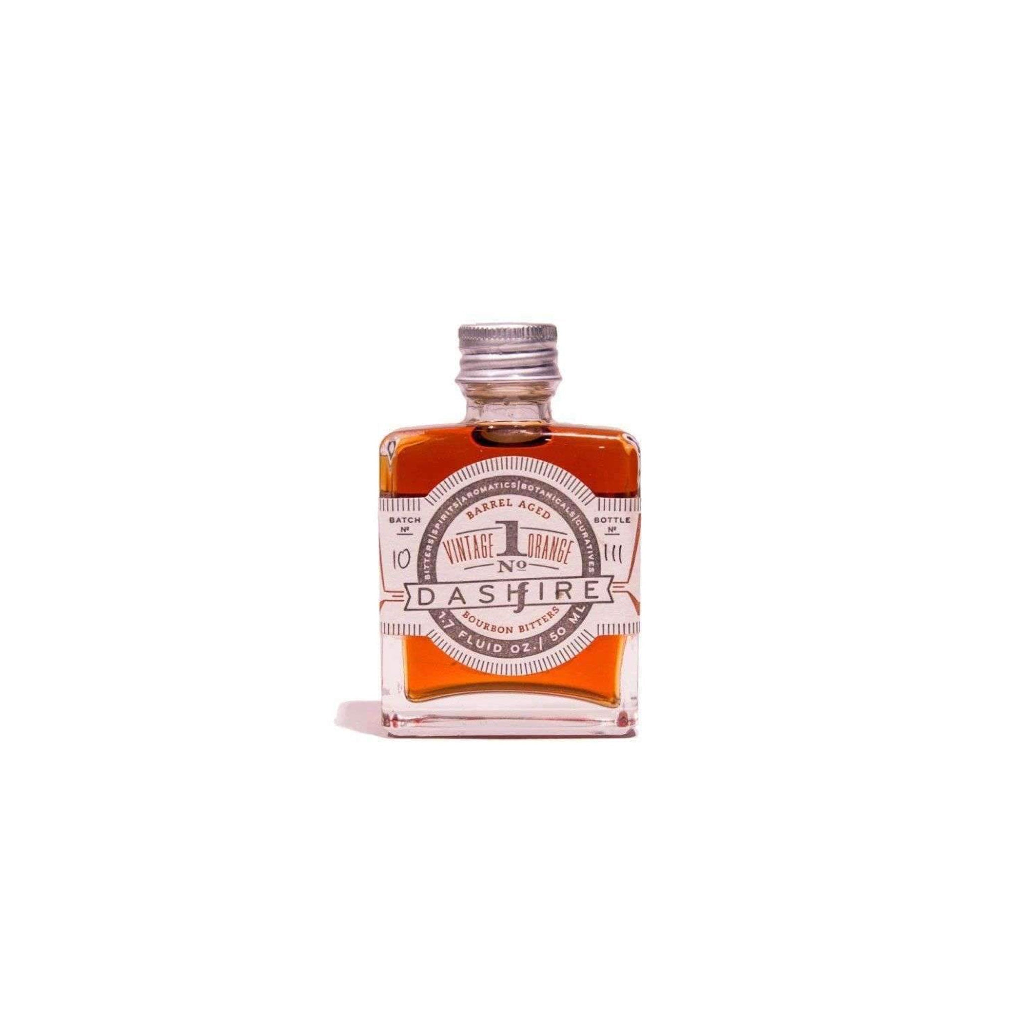 bottle of barrel aged orange bitters on white background