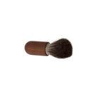 Small walnut wooden shaving brush with dakr badger hair bristles on white background